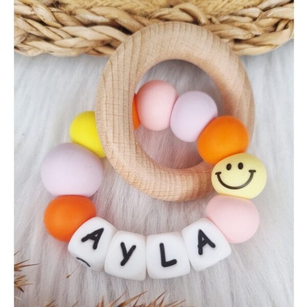 Bijtring met naam Smiley babypink