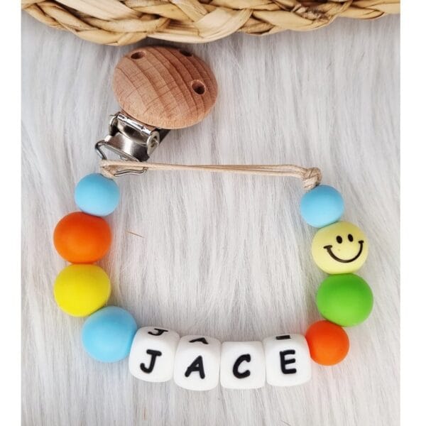 Speenkoord met naam Smiley babyblauw
